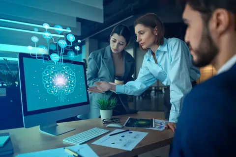 A business woman presenting to her coworkers using AI tools